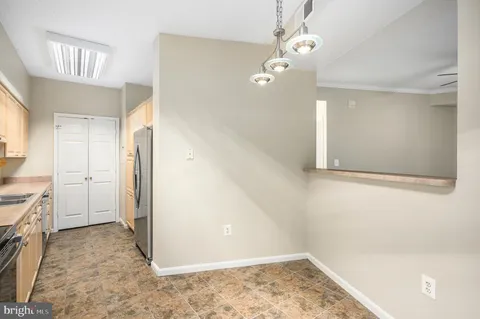 a kitchen with a sink and a refrigerator
