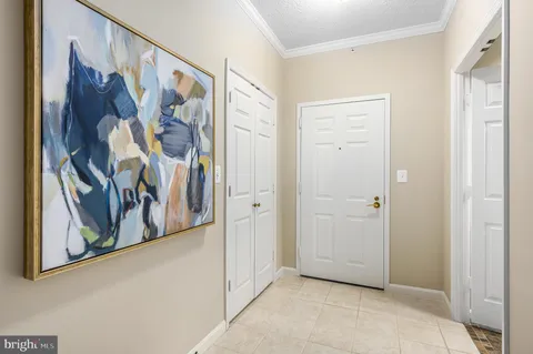 a view of a hallway with paintings on the wall