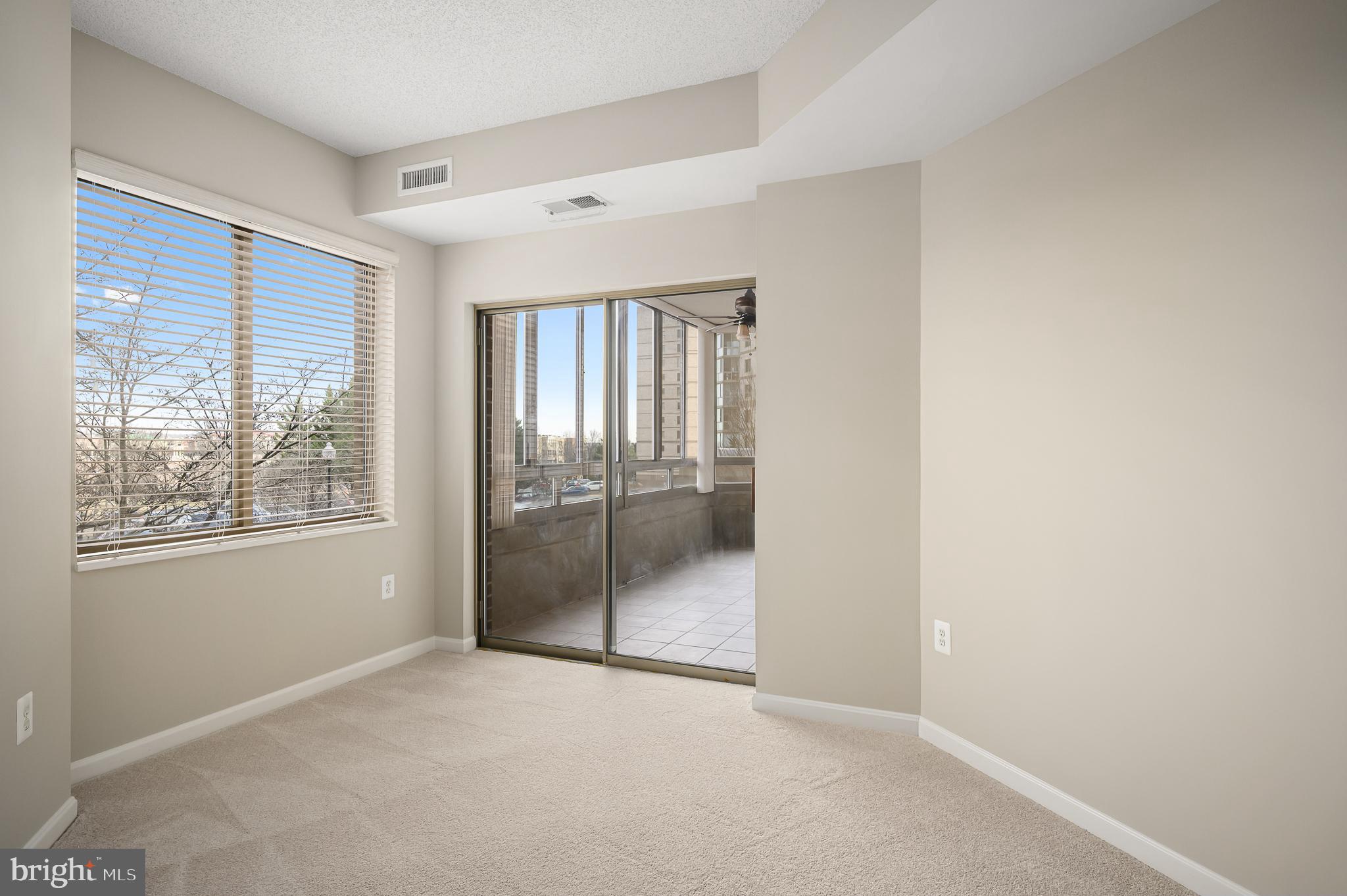 19375 Cypress Ridge Terrace, Unit 114 Leesburg, VA 20176 - Photo 18 of 41 2nd bedroom with NEW carpet and access to sunroom