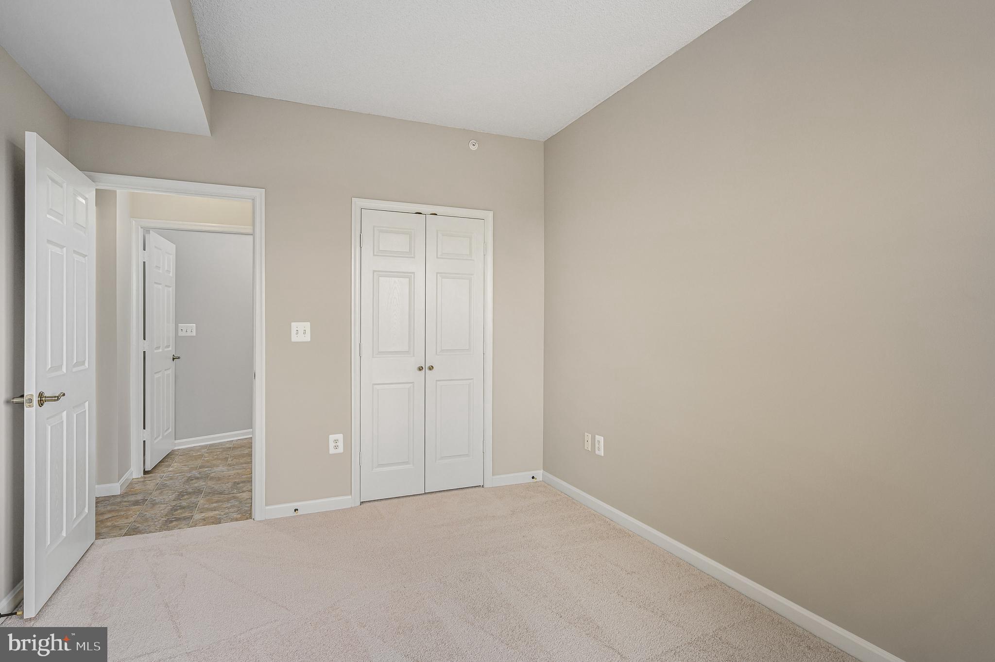 19375 Cypress Ridge Terrace, Unit 114 Leesburg, VA 20176 - Photo 19 of 41 2nd bedroom with walk-in closet next to bath
