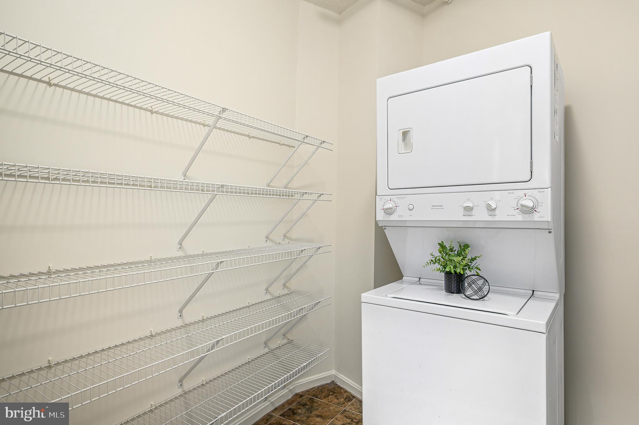 19375 Cypress Ridge Terrace, Unit 114 Leesburg, VA 20176 - Photo 21 of 42 a utility room with dryer and washer