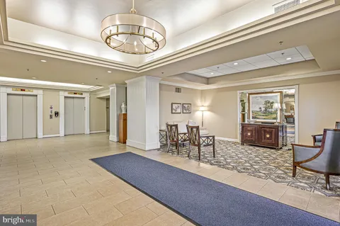 a view of a livingroom with furniture and chandelier