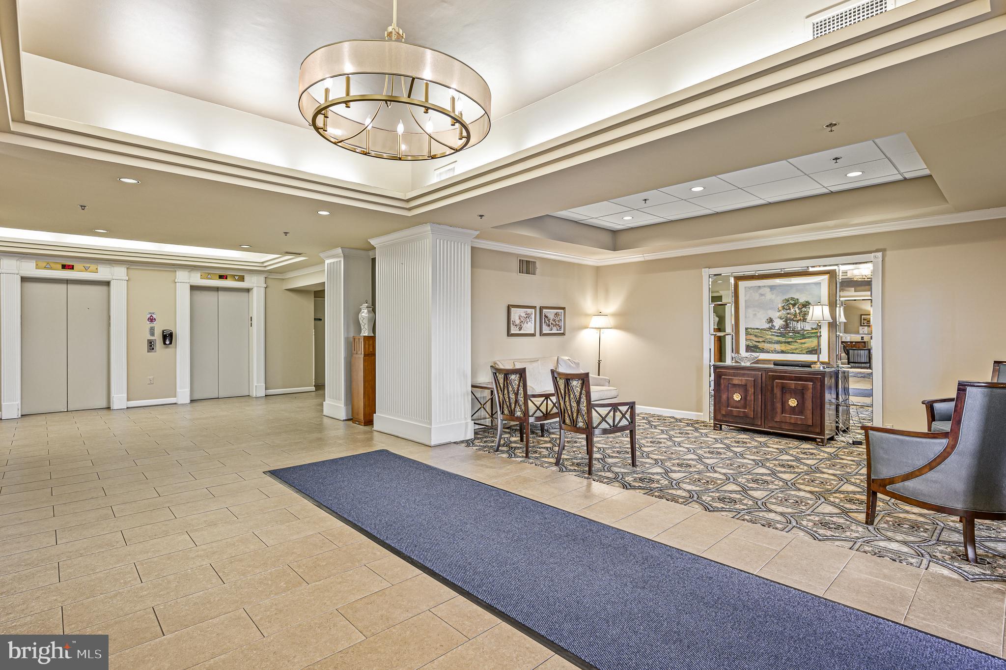 19375 Cypress Ridge Terrace, Unit 114 Leesburg, VA 20176 - Photo 33 of 42 a view of a livingroom with furniture and chandelier
