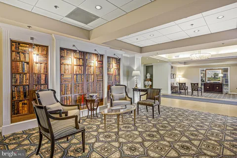 a view of a livingroom with furniture and chandelier