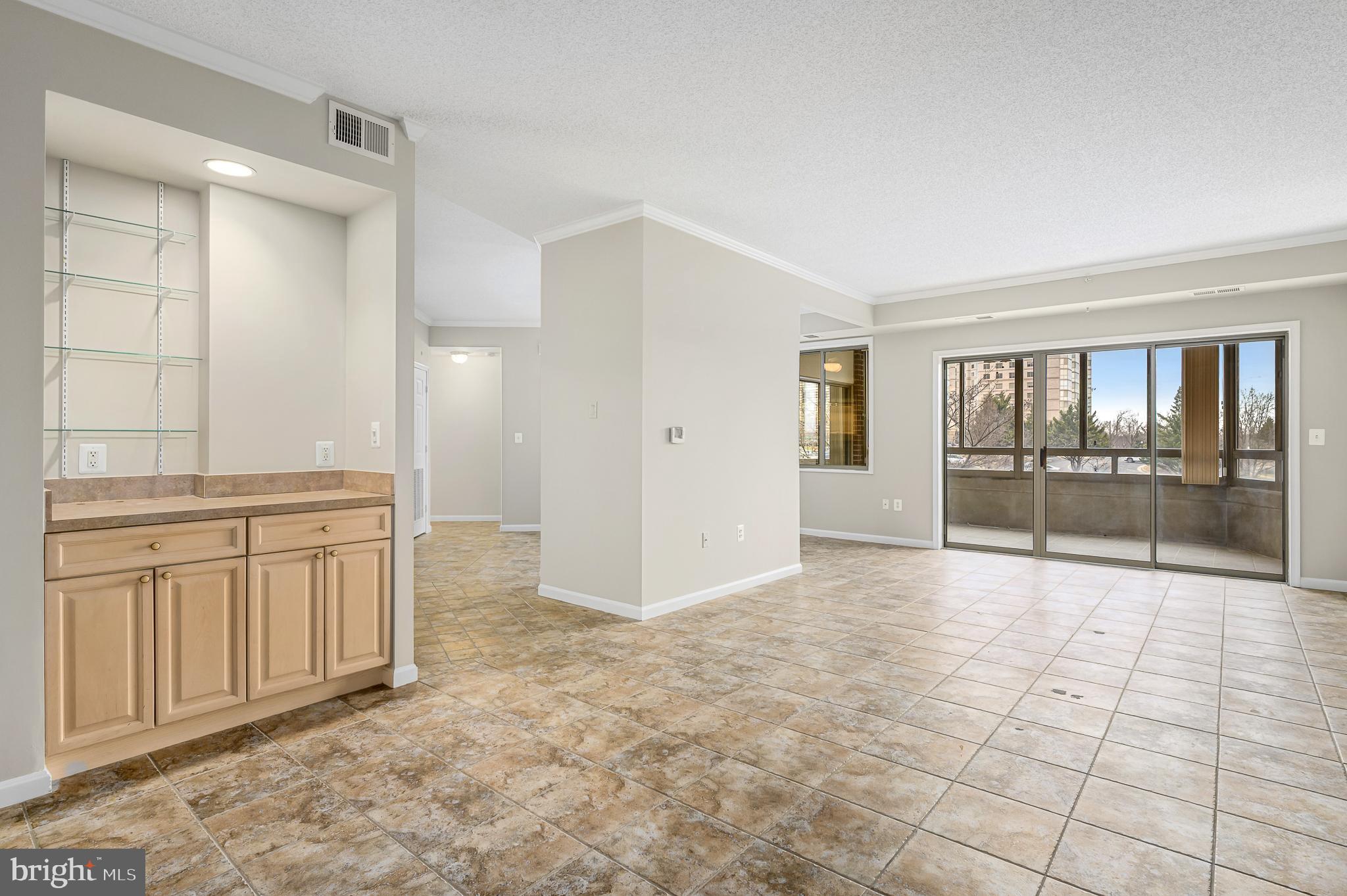 19375 Cypress Ridge Terrace, Unit 114 Leesburg, VA 20176 - Photo 5 of 41 Custom built in cabinetry and lighting in Dining