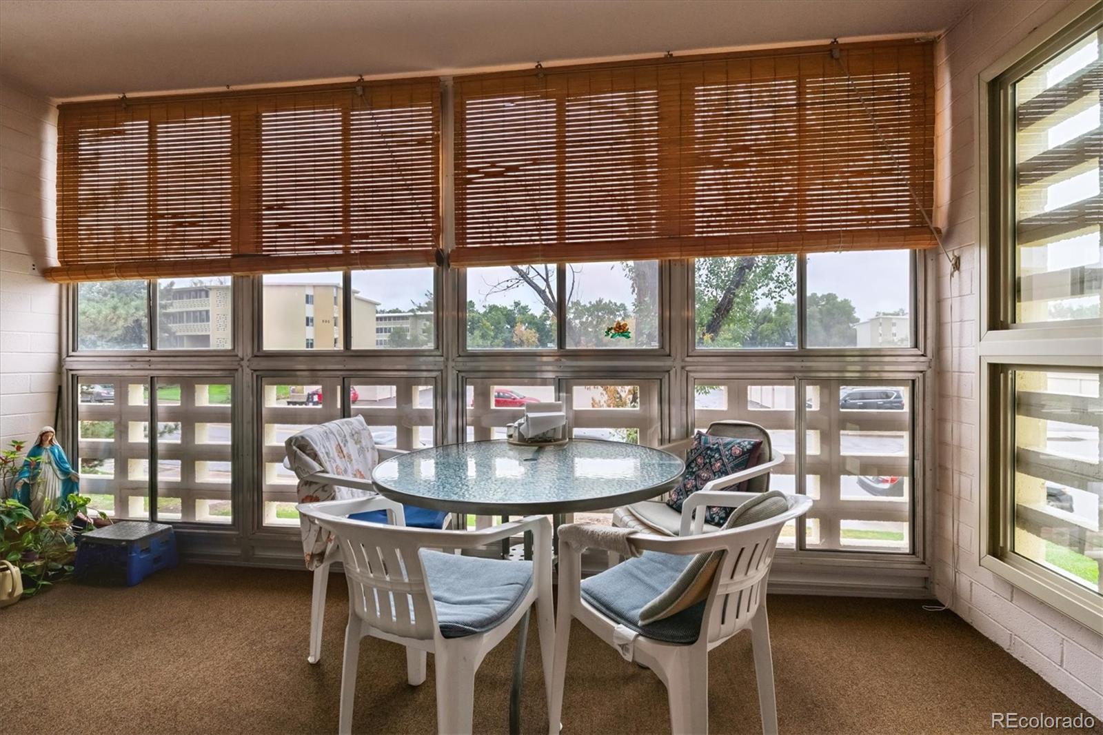 680 South Alton Way, Unit 9B Denver, CO 80247 - Photo 14 of 31 a dining room with furniture and windows