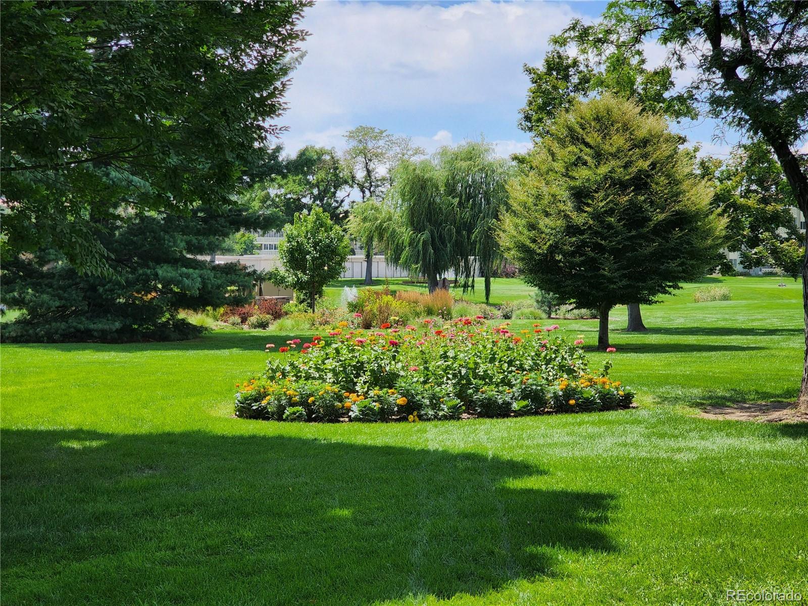 680 South Alton Way, Unit 9B Denver, CO 80247 - Photo 28 of 31 a view of a garden with a tree