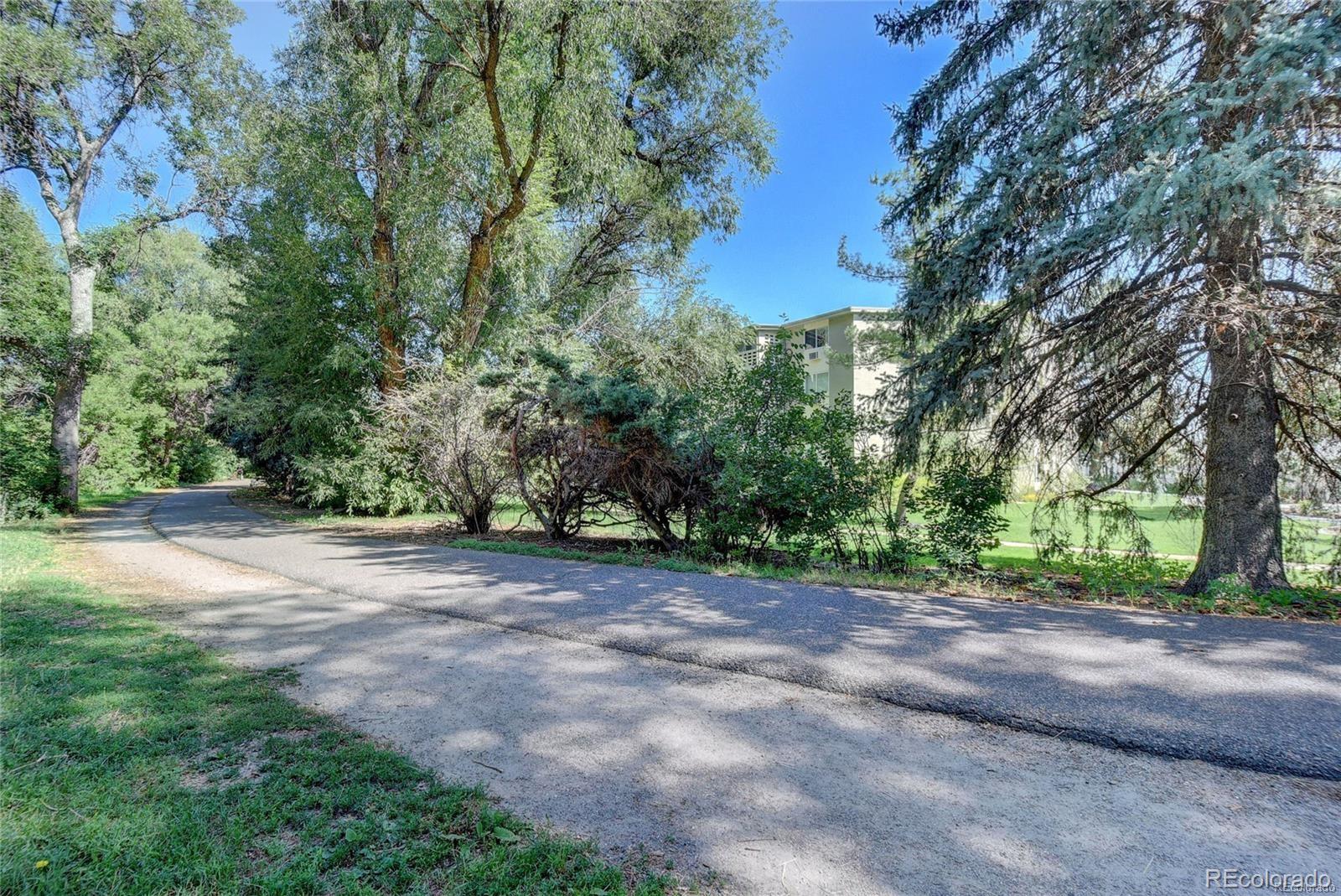 680 South Alton Way, Unit 9B Denver, CO 80247 - Photo 31 of 31 a view of a yard with a tree