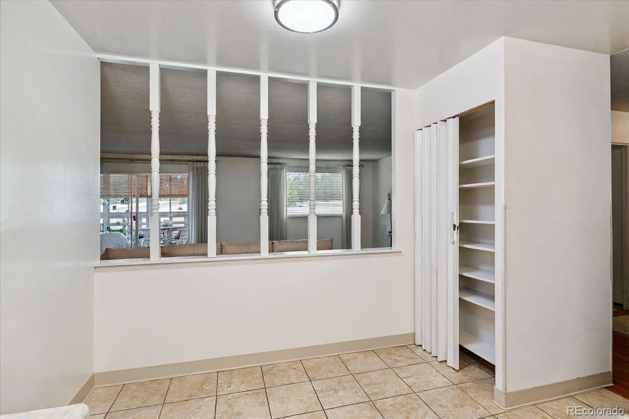 680 South Alton Way, Unit 9B Denver, CO 80247 - Photo 5 of 31 a view of wooden floor and windows in a room