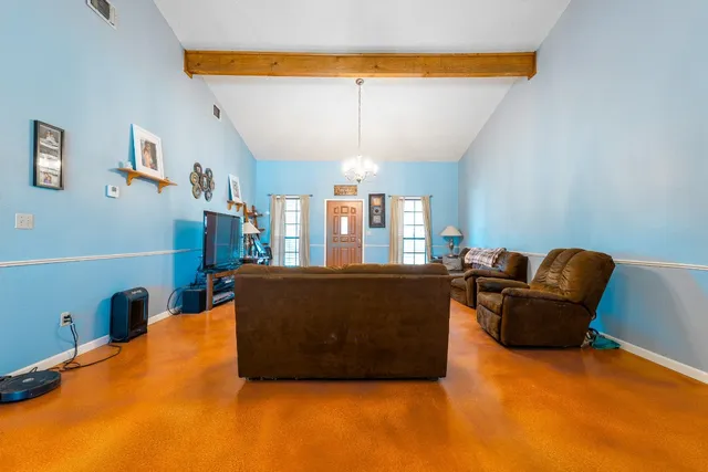a view of a livingroom with furniture and a fireplace