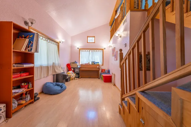 a living room filled with furniture and a chandelier