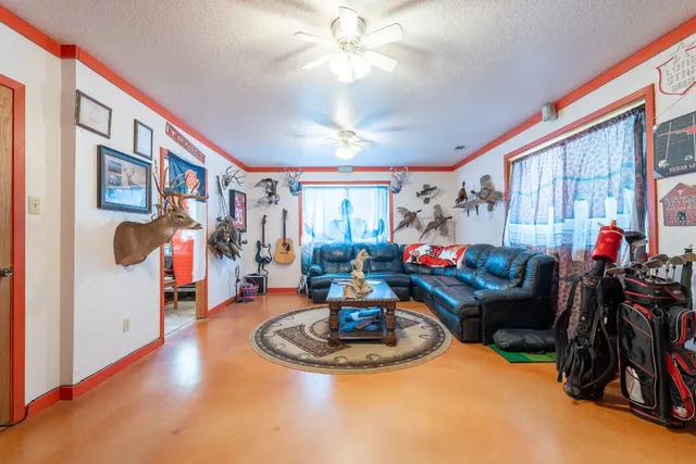 a kitchen with a refrigerator a stove a sink and a dining table