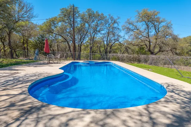 a view of swimming pool with a yard