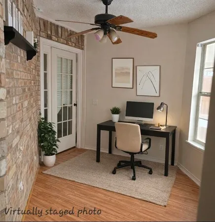 a kitchen with a sink a stove cabinets and a window