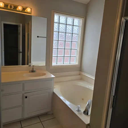 a view of bathroom with mirror