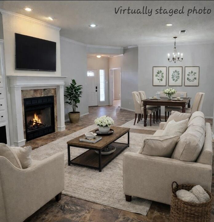 6701 Chicago Avenue Lubbock, TX 79424 - Photo 3 of 35 a living room with furniture a fireplace and a flat screen tv