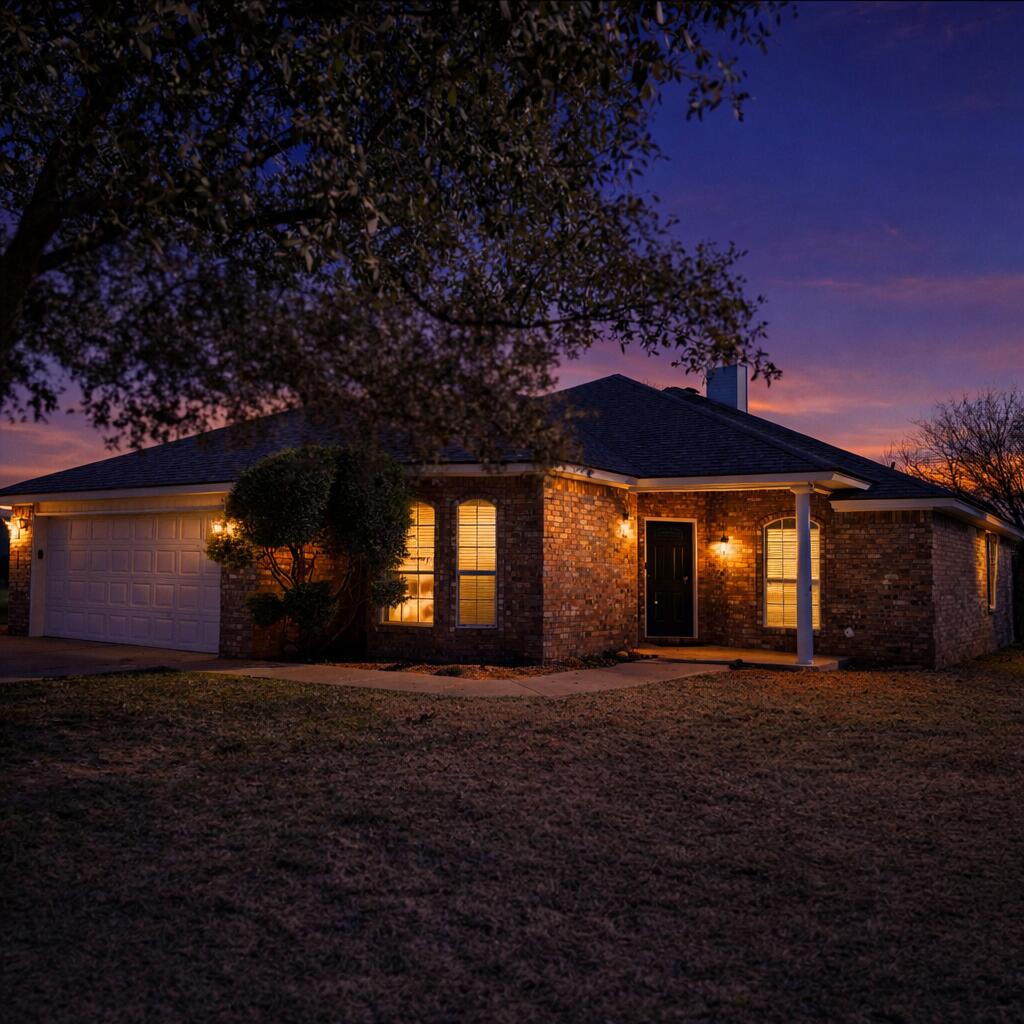 6701 Chicago Avenue Lubbock, TX 79424 - Photo 31 of 35 a front view of a house with a yard