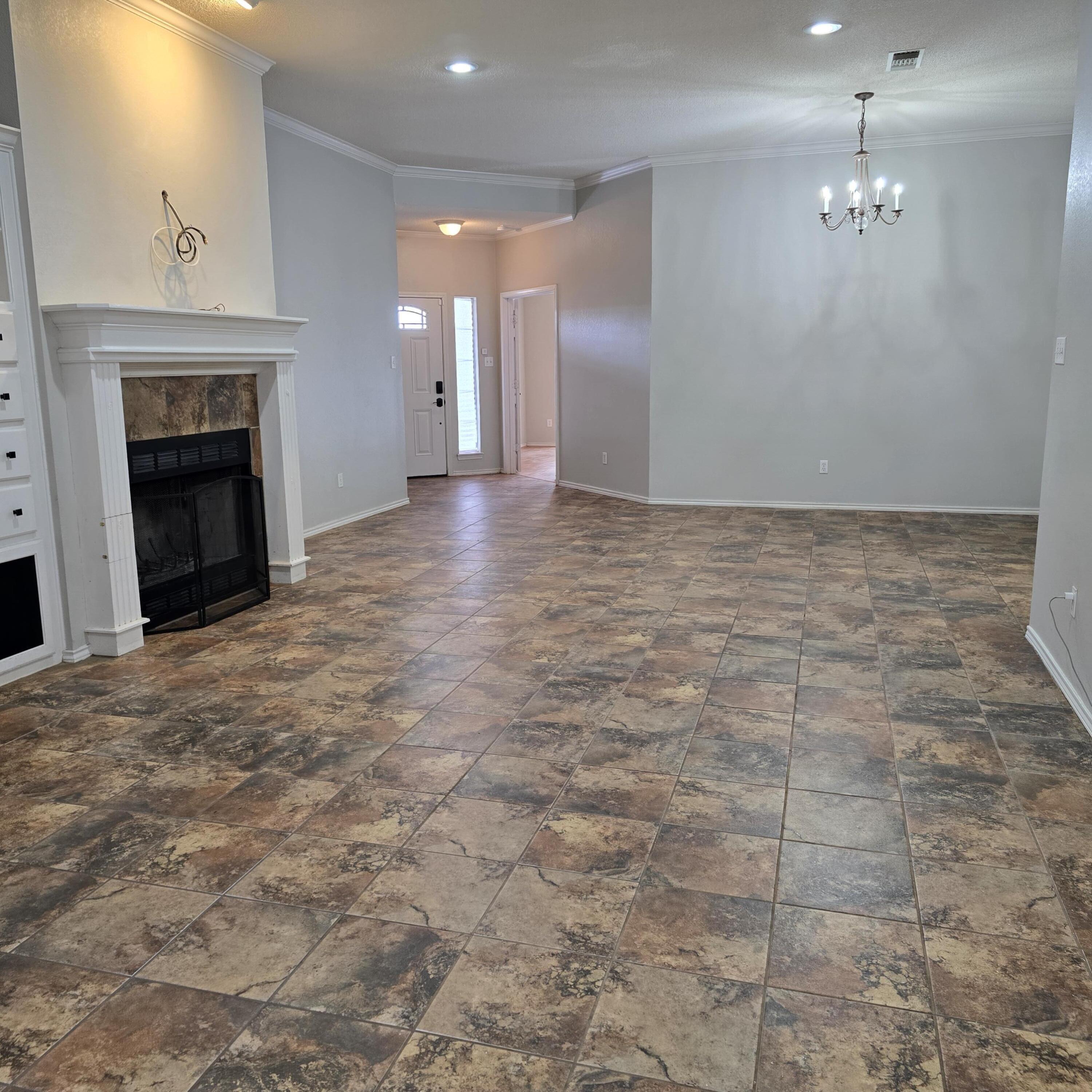 6701 Chicago Avenue Lubbock, TX 79424 - Photo 33 of 35 a view of an empty room with a fireplace