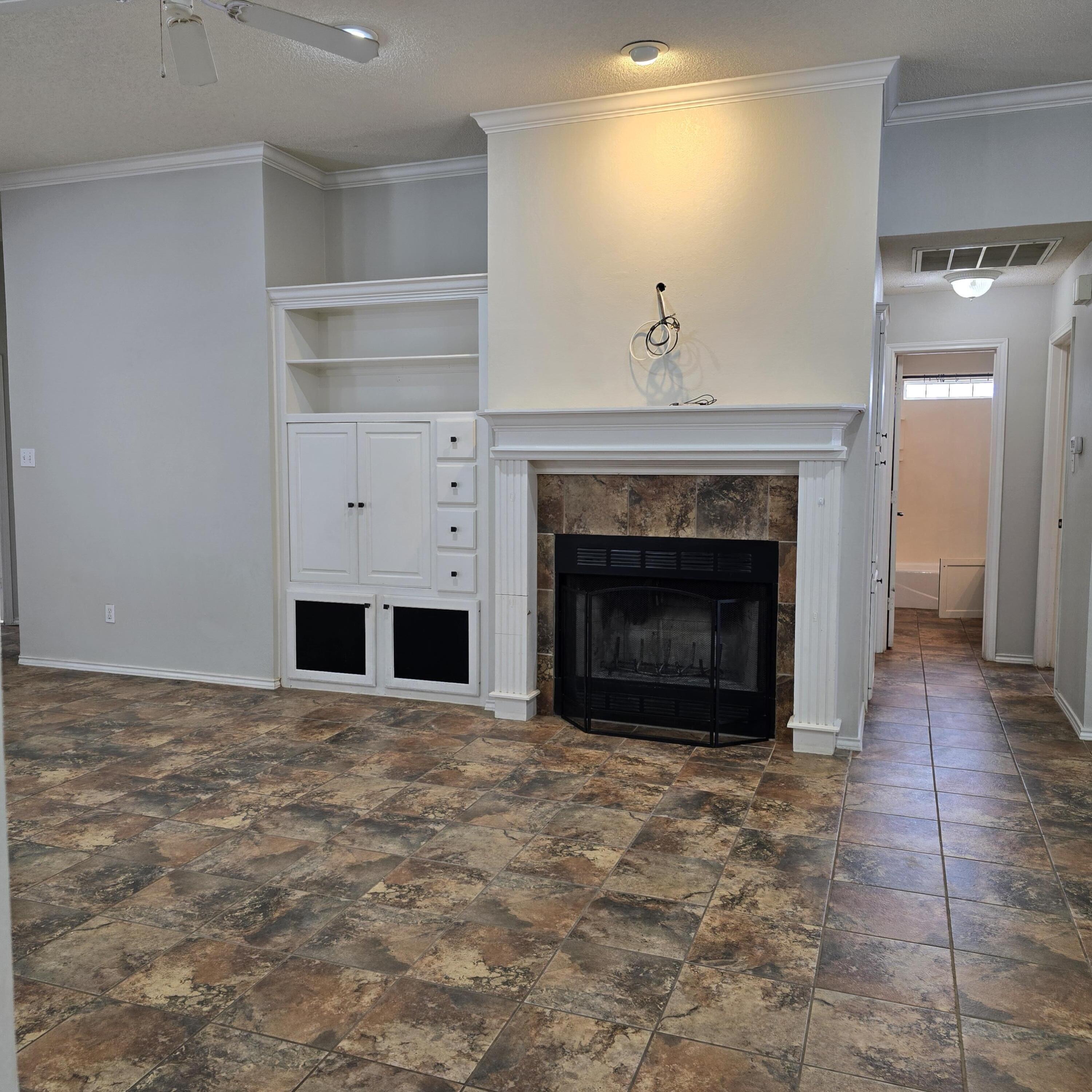 6701 Chicago Avenue Lubbock, TX 79424 - Photo 4 of 35 a view of empty room with a fireplace