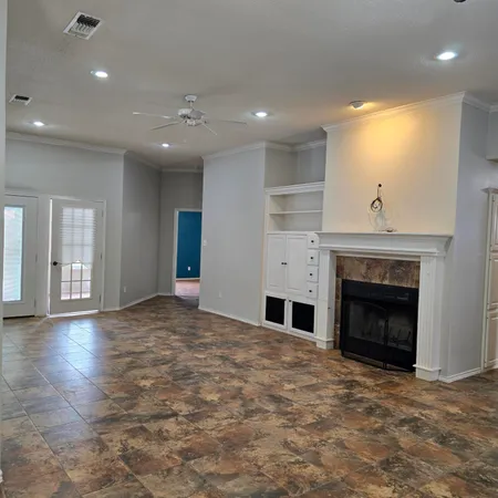 a view of empty room with a fireplace