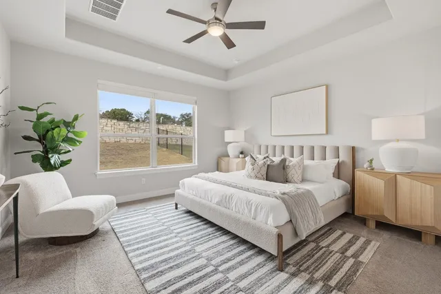 a bedroom with a large bed and a couch