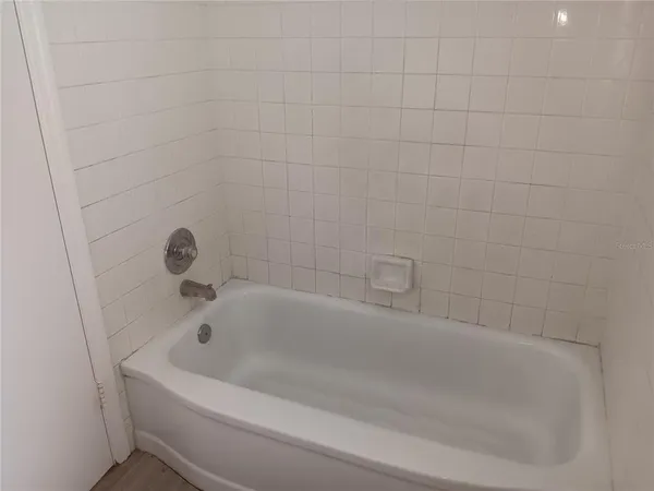 a white bath tub sitting in a bathroom