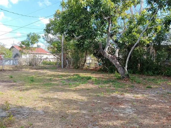 a view of backyard with green space
