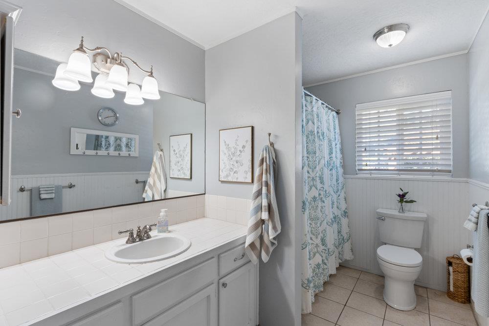 315 Kessler Way Ben Lomond, CA 95005 - Photo 23 of 50 a bathroom with a granite countertop sink a toilet and a mirror