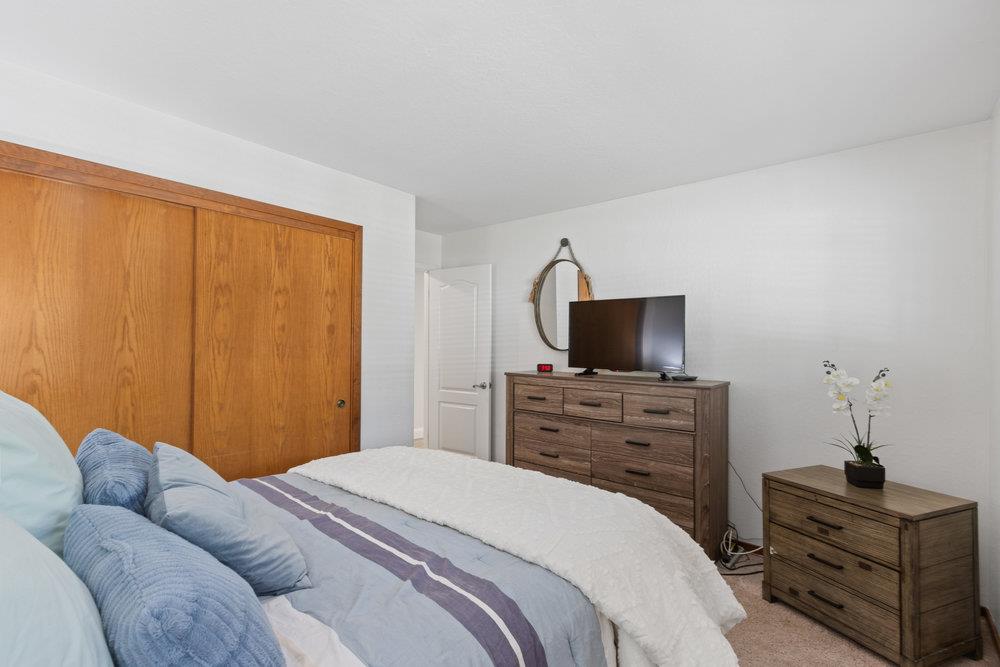 315 Kessler Way Ben Lomond, CA 95005 - Photo 25 of 50 a bedroom with a bed and a flat screen tv