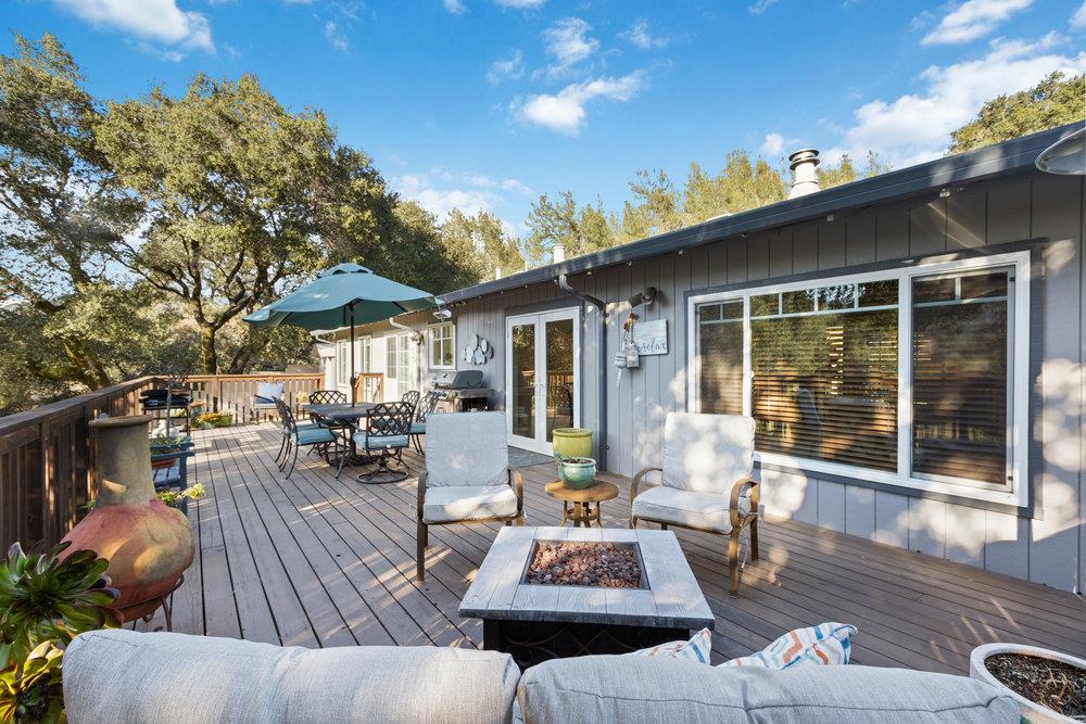 315 Kessler Way Ben Lomond, CA 95005 - Photo 33 of 50 a view of a patio with couches table and chairs and potted plants