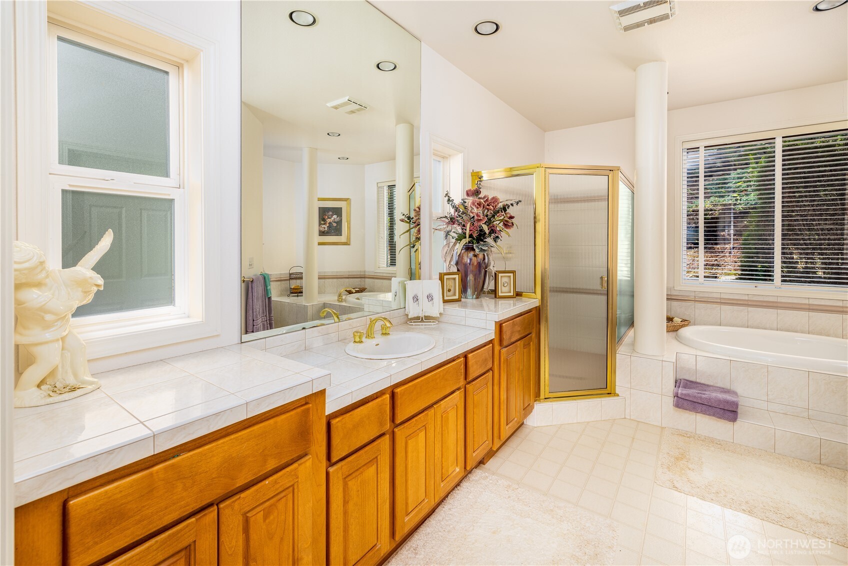 33571 Cliff Road Mount Vernon, WA 98274 - Photo 18 of 38 a spacious bathroom with a granite countertop sink mirror and a bath tub