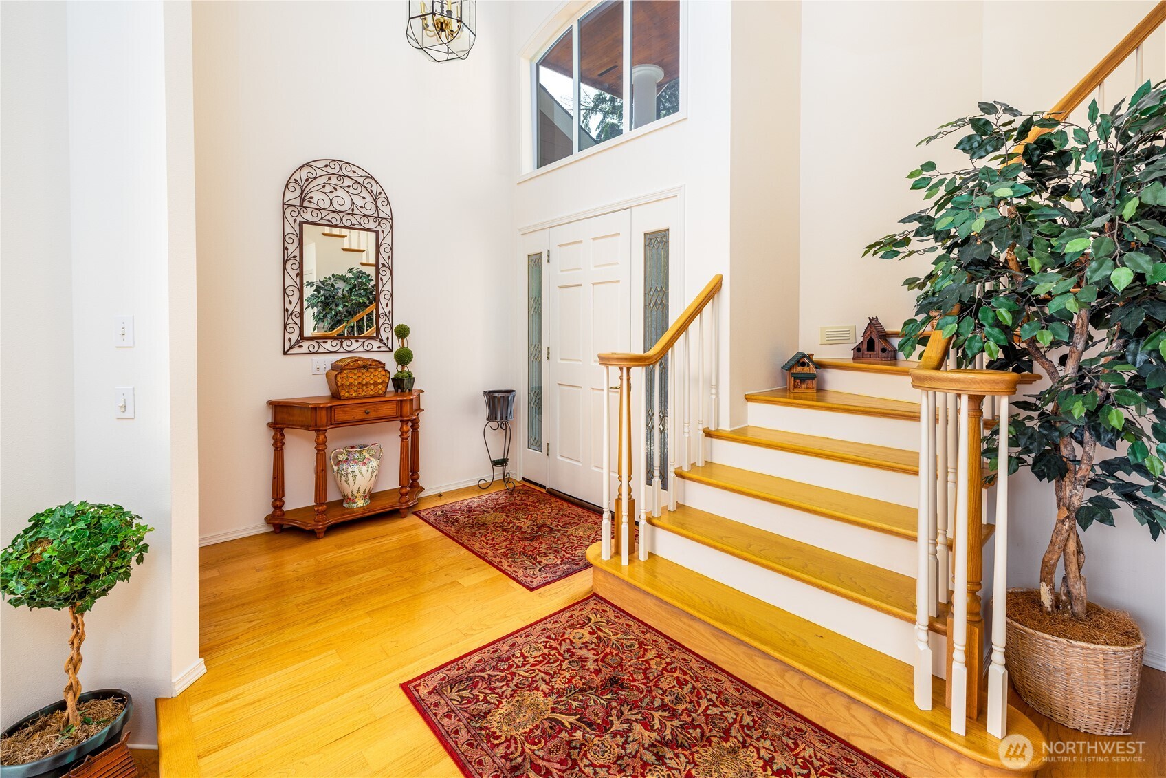 33571 Cliff Road Mount Vernon, WA 98274 - Photo 19 of 38 a view of a bedroom with wooden floor and a potted plant