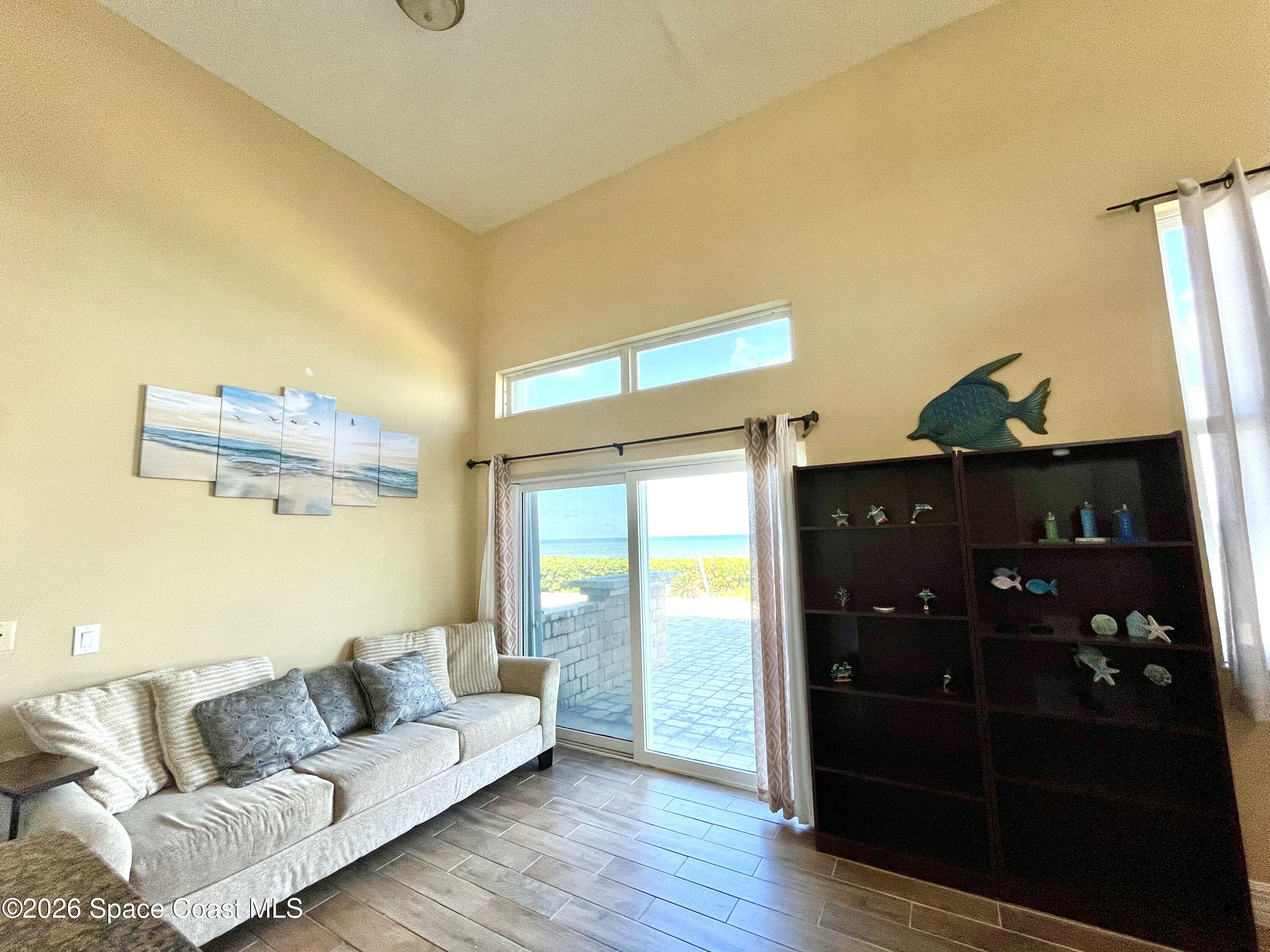 799 Shell Street Satellite Beach, FL 32937 - Photo 11 of 32 a living room with furniture and wooden floor