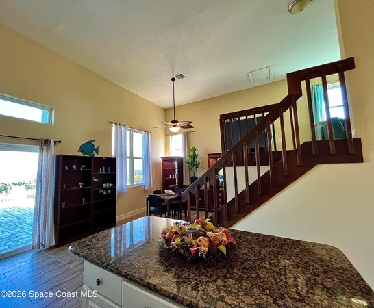 a view of a living room and dining room