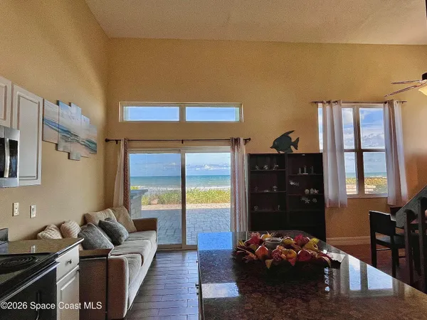 a living room with furniture rug and window