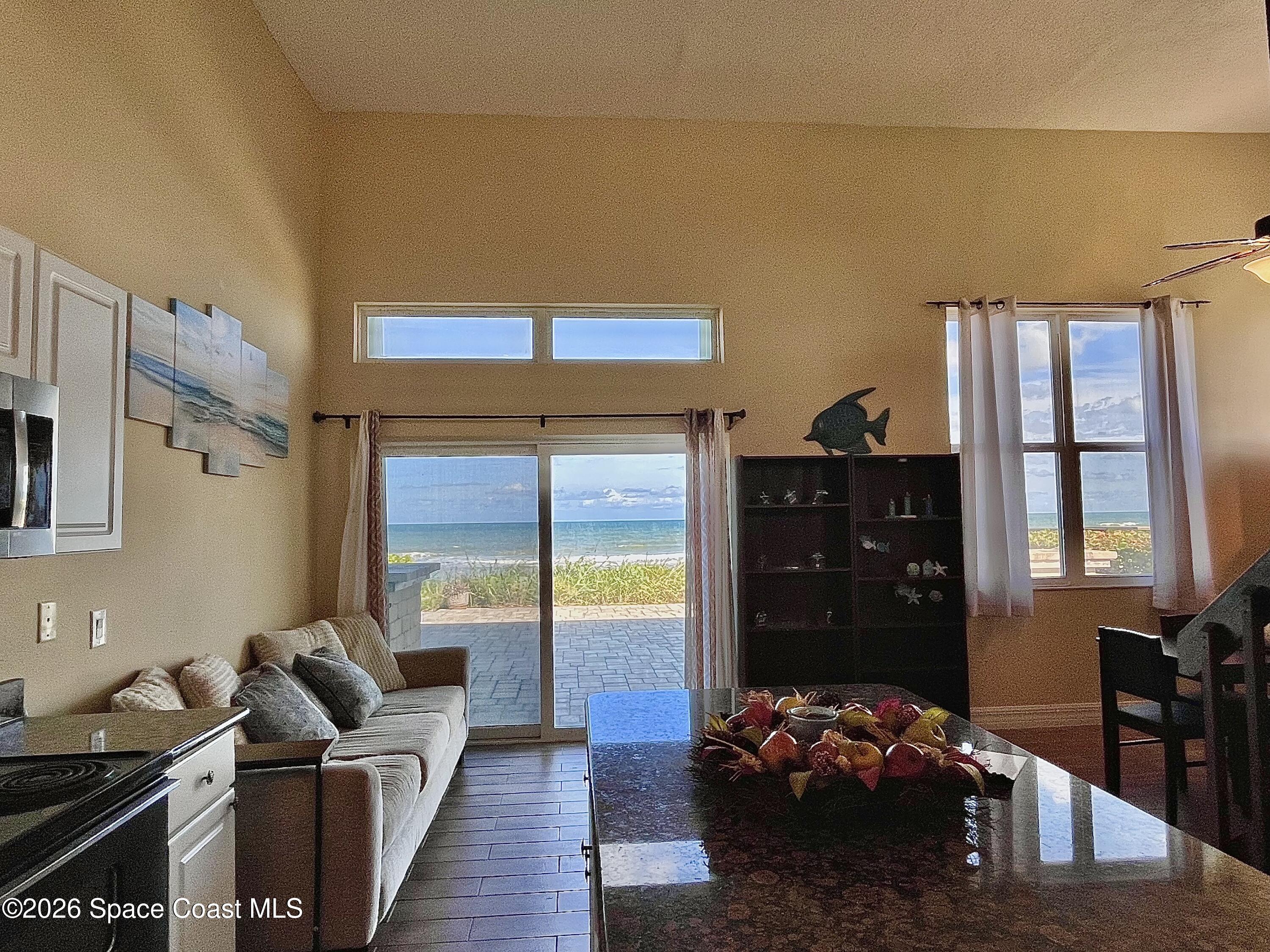 799 Shell Street Satellite Beach, FL 32937 - Photo 15 of 32 a living room with furniture rug and window