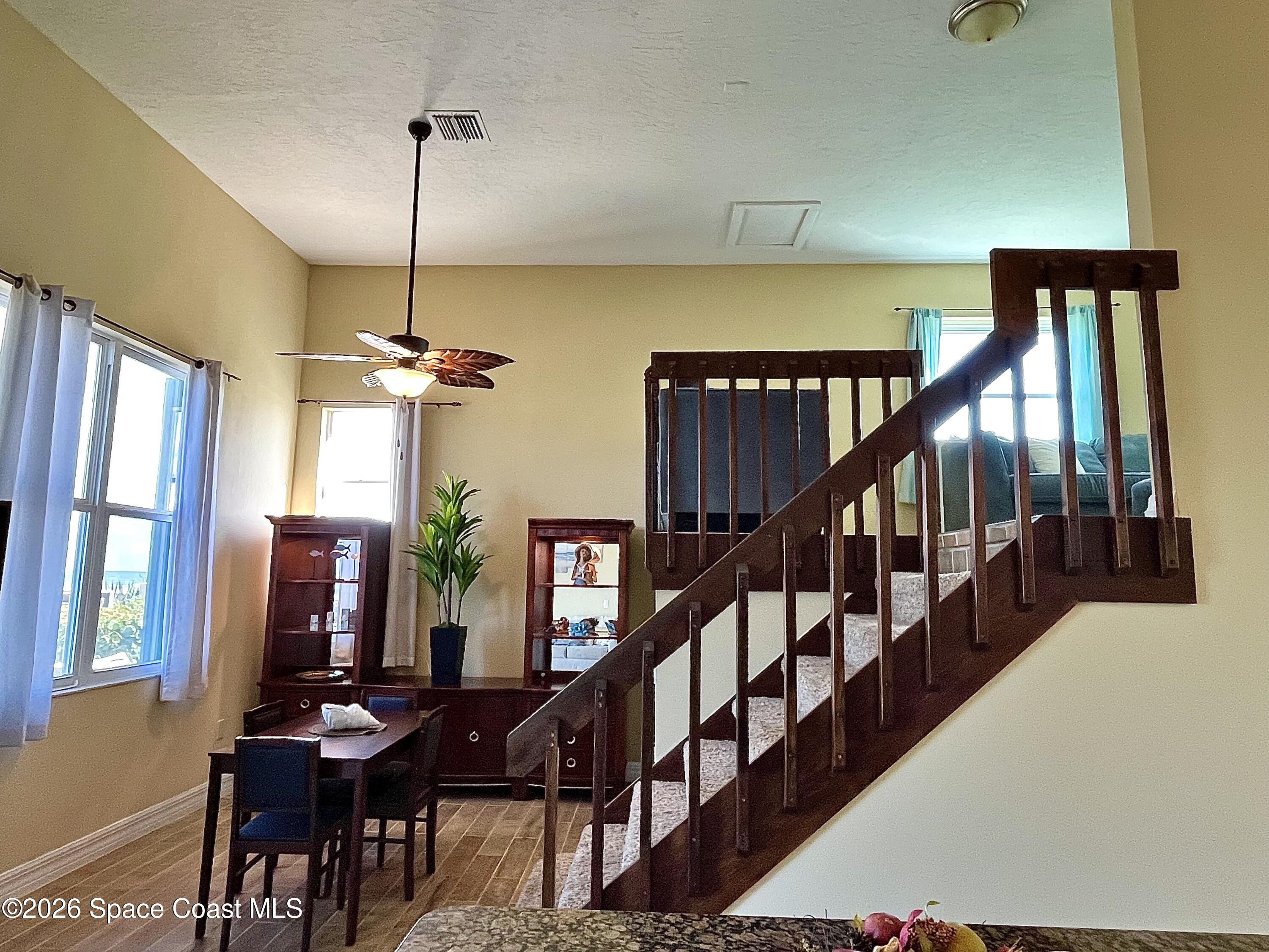 799 Shell Street Satellite Beach, FL 32937 - Photo 17 of 32 a view of a dining room with furniture window and wooden floor