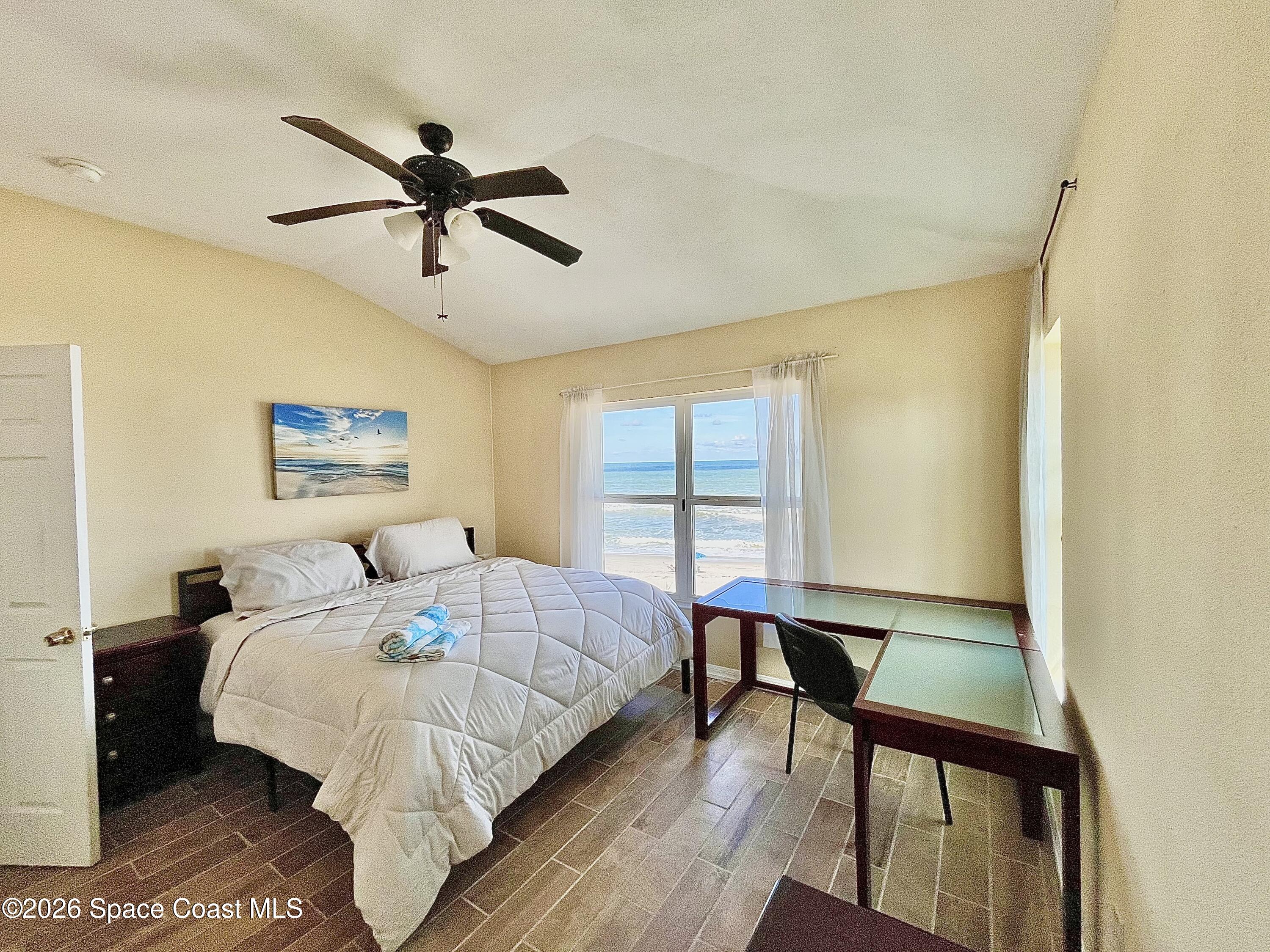799 Shell Street Satellite Beach, FL 32937 - Photo 23 of 32 a bed sitting in a bedroom next to a window