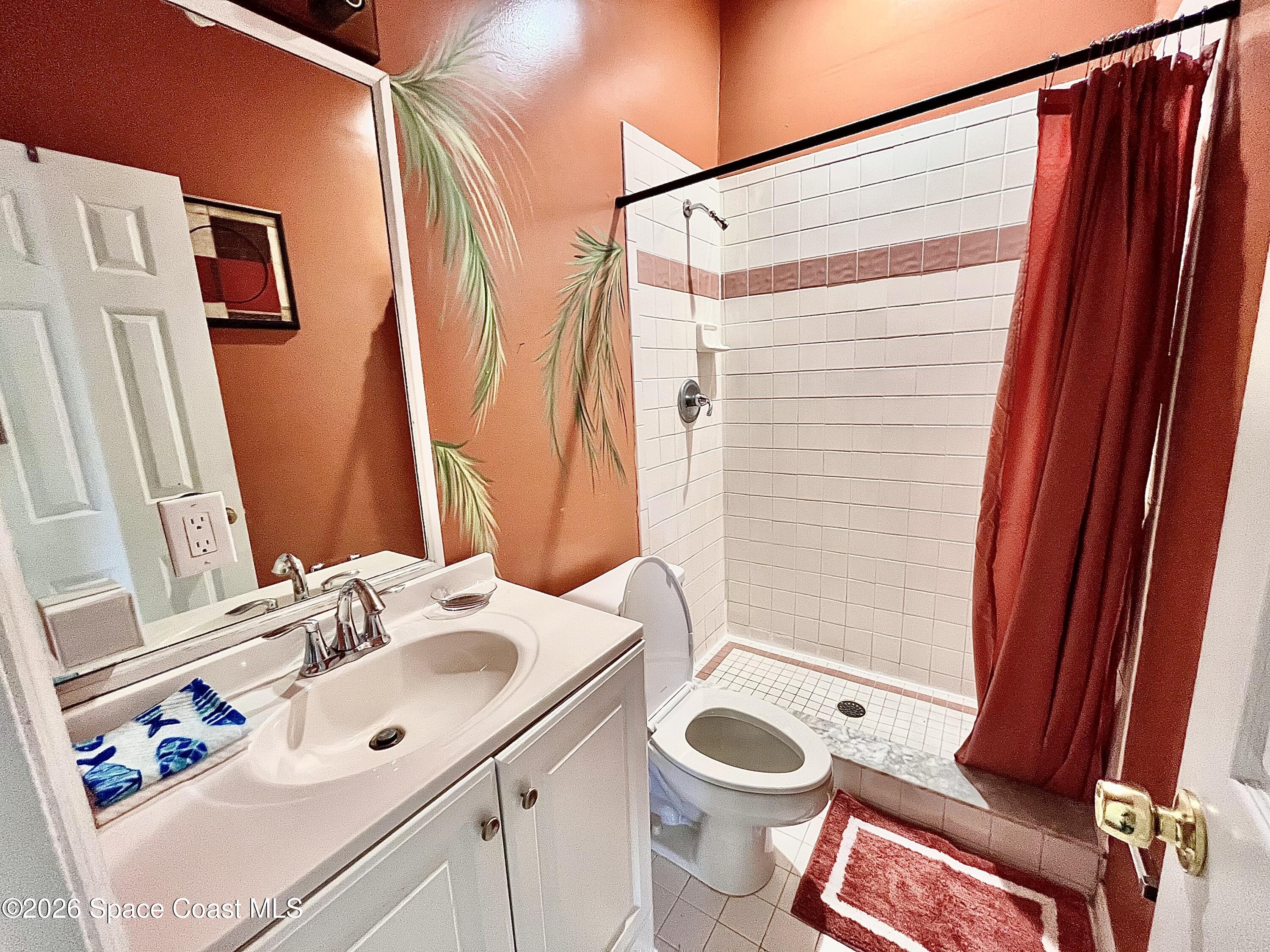 799 Shell Street Satellite Beach, FL 32937 - Photo 28 of 32 a bathroom with a sink and a mirror