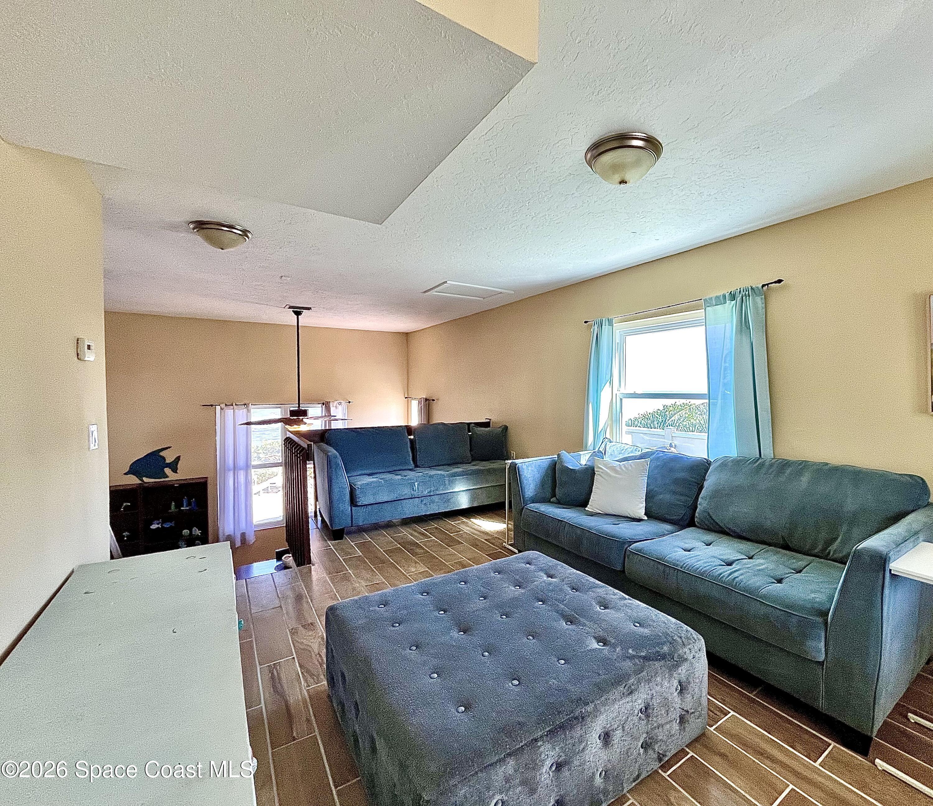 799 Shell Street Satellite Beach, FL 32937 - Photo 3 of 32 a living room with furniture and a couch