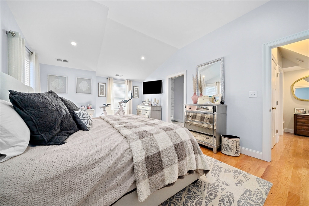 11 Mason Street, Unit 2 Everett, MA 02149 - Photo 15 of 28 a spacious bedroom with a bed and wooden floor