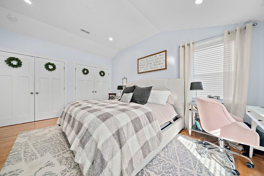 11 Mason Street, Unit 2 Everett, MA 02149 - Photo 16 of 28 a bed room with a bed a chair and a window