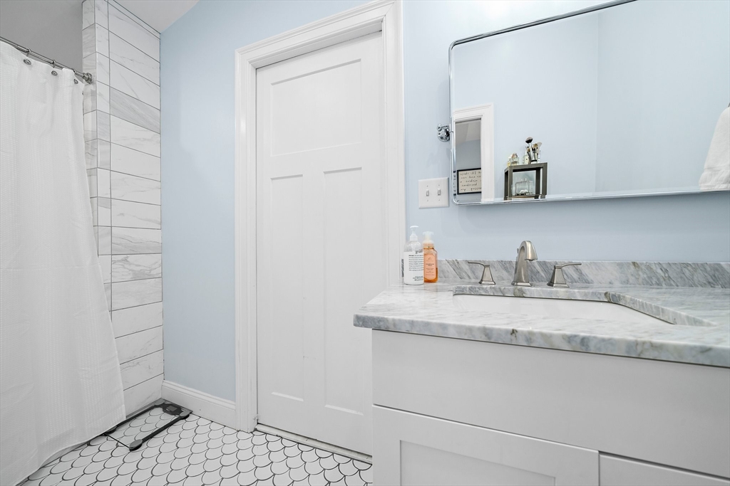 11 Mason Street, Unit 2 Everett, MA 02149 - Photo 20 of 28 a bathroom with a sink and a mirror