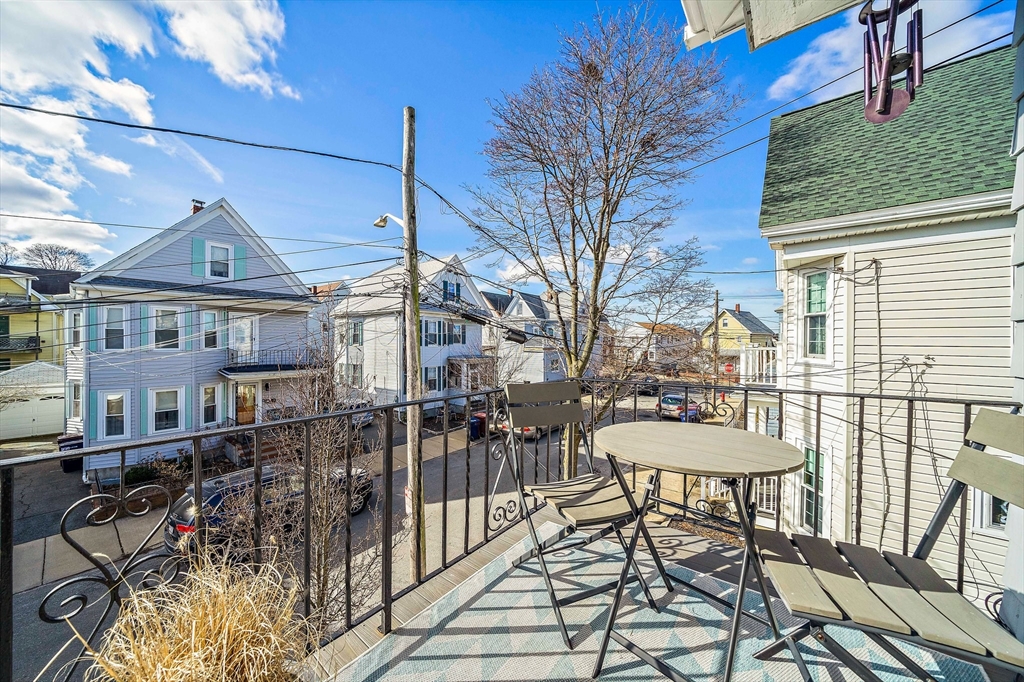11 Mason Street, Unit 2 Everett, MA 02149 - Photo 21 of 28 a view of a chairs and table in the patio