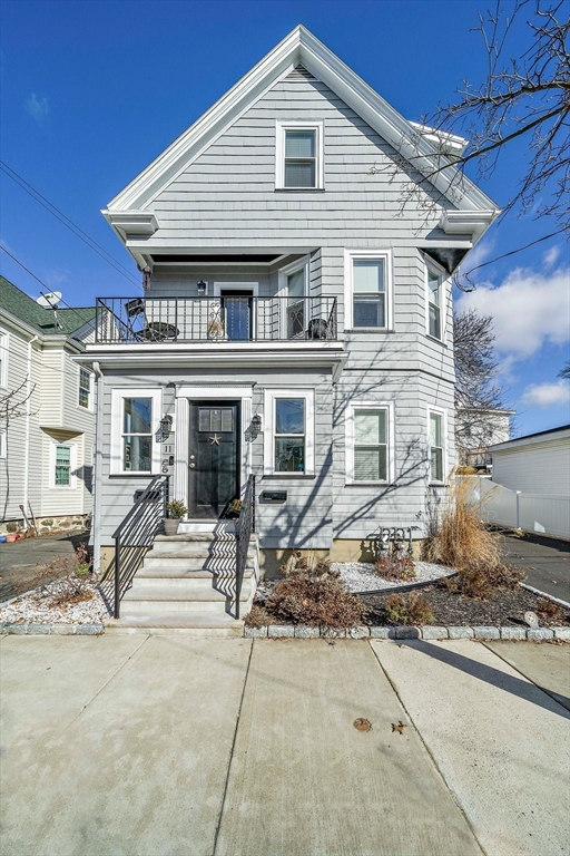 11 Mason Street, Unit 2 Everett, MA 02149 - Photo 24 of 28 a front view of a house with many windows