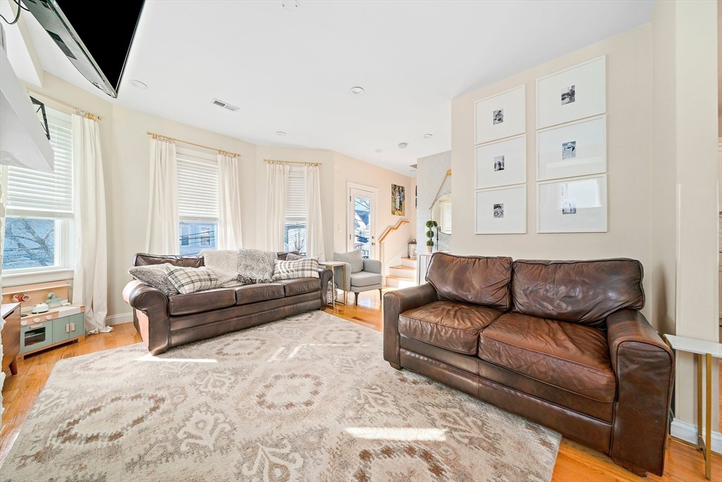 11 Mason Street, Unit 2 Everett, MA 02149 - Photo 6 of 28 a living room with furniture and a large window