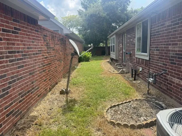 a view of backyard with green space
