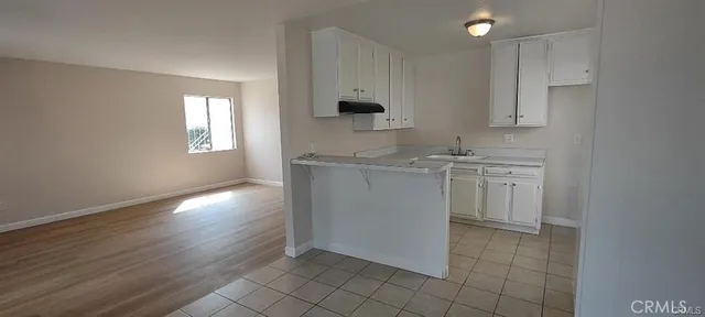 a view of a kitchen with electric appliances