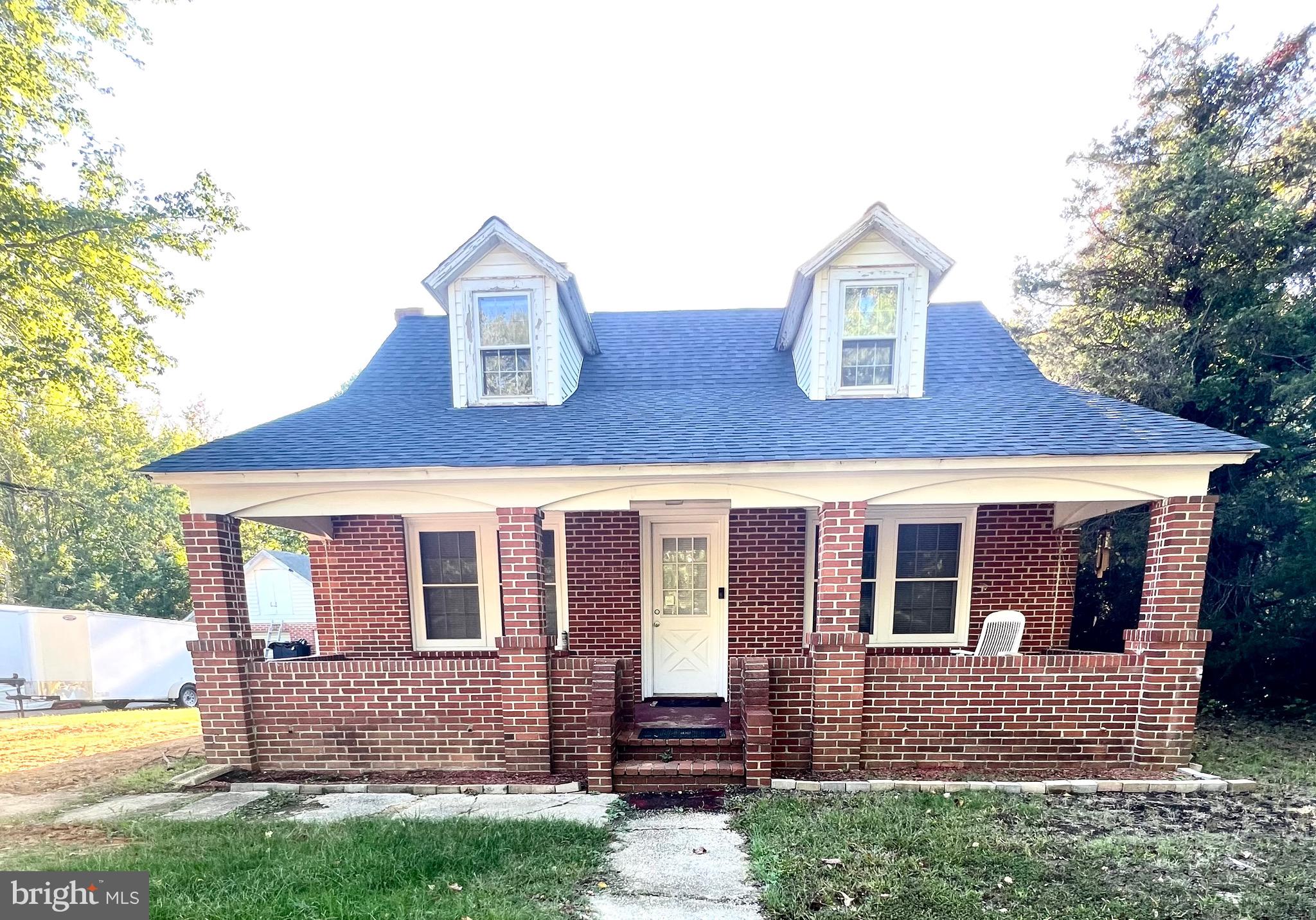 a house view with a garden space