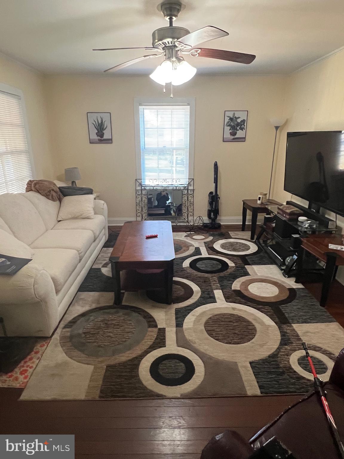 24691 Old 3 Notch Road Hollywood, MD 20636 - Photo 2 of 6 a living room with furniture and a flat screen tv